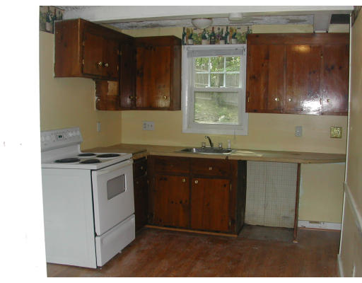8 Austin Road Billerica, MA 01821 - Photo 5 of 13 a kitchen with a sink cabinets and a window