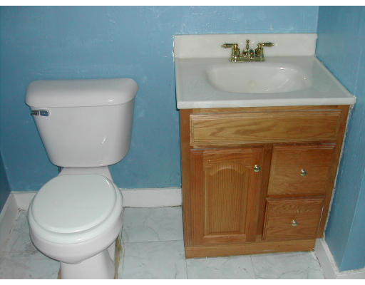 8 Austin Road Billerica, MA 01821 - Photo 7 of 13 a bathroom with a toilet and a sink