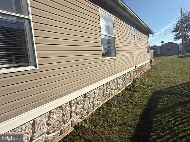 a view of a balcony with wooden floor