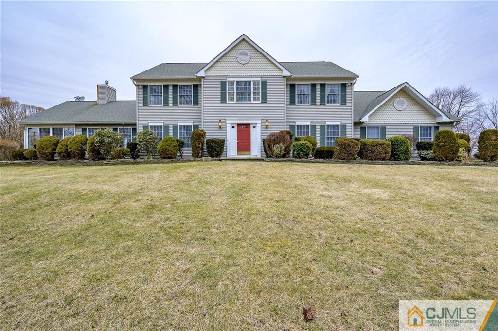 a front view of a house with yard