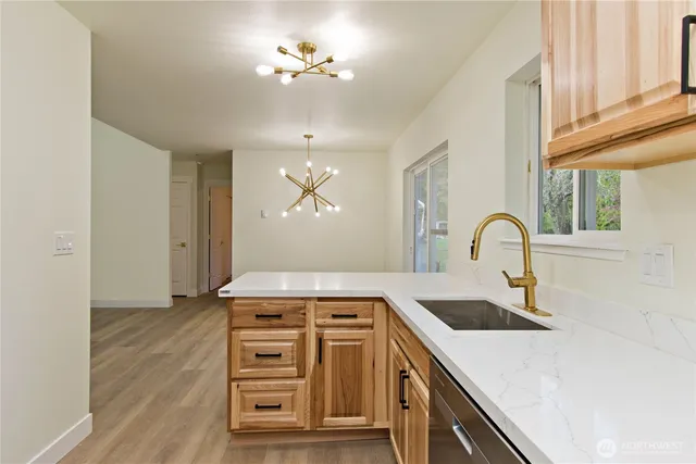 a kitchen with a stove and a sink