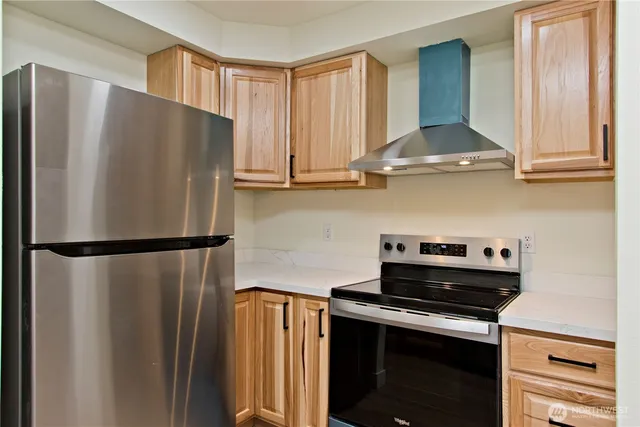 a white refrigerator freezer sitting inside of a kitchen