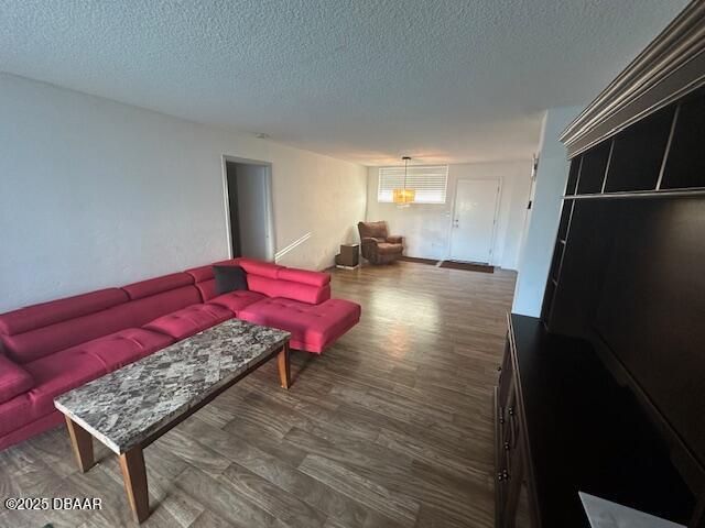 2727 North Atlantic Avenue, Unit 211 Daytona Beach, FL 32118 - Photo 11 of 38 a living room with furniture and a wooden floor