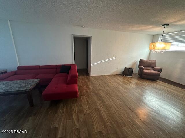 2727 North Atlantic Avenue, Unit 211 Daytona Beach, FL 32118 - Photo 13 of 38 a living room with furniture and a wooden floor