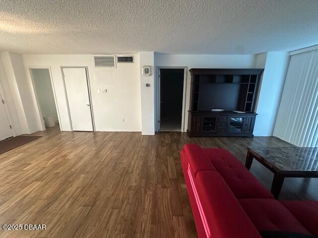 2727 North Atlantic Avenue, Unit 211 Daytona Beach, FL 32118 - Photo 14 of 38 a living room with furniture and a flat screen tv