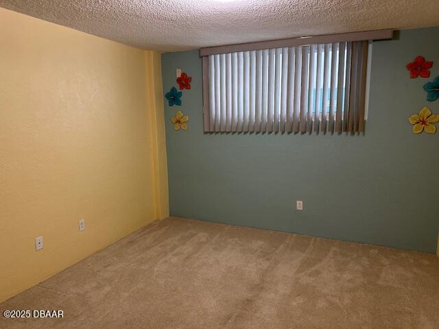 2727 North Atlantic Avenue, Unit 211 Daytona Beach, FL 32118 - Photo 21 of 38 an empty room with a window
