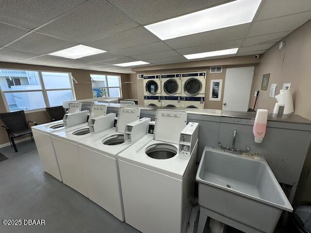 2727 North Atlantic Avenue, Unit 211 Daytona Beach, FL 32118 - Photo 37 of 38 a kitchen with a stove a table and chairs