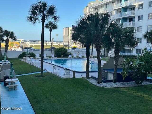 2727 North Atlantic Avenue, Unit 211 Daytona Beach, FL 32118 - Photo 7 of 38 a view of a garden with a tree