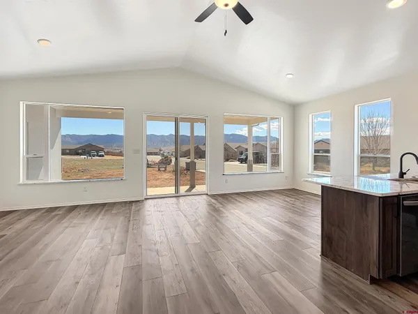 a kitchen with a wooden floor and window