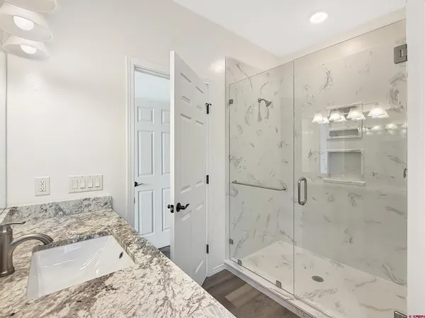 a bathroom with a bathtub and shower