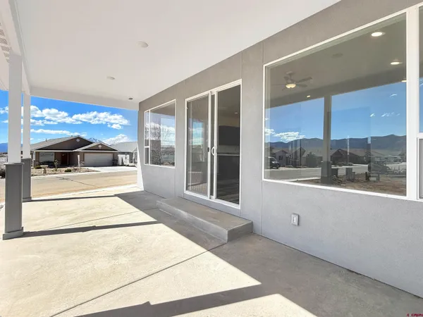 a room with a large window and a mirror