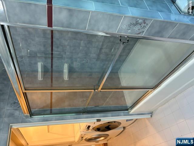 19 Crescent Road Wayne, NJ 07470 - Photo 15 of 26 a bathroom with a glass shower door