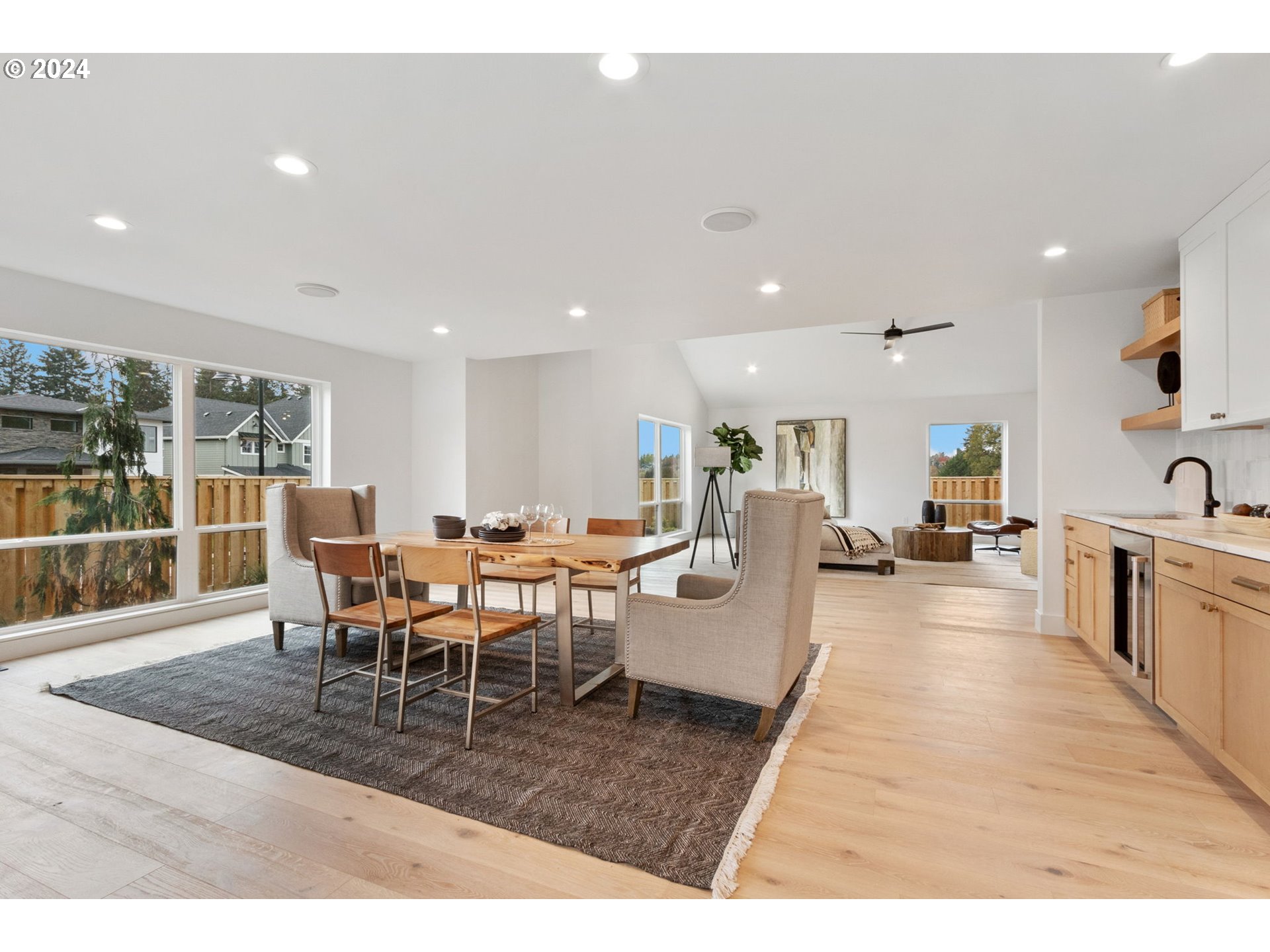 23141 Southwest Curry Ridge Drive Sherwood, OR 97140 - Photo 11 of 47 a view of a dining hall with dining table and chairs