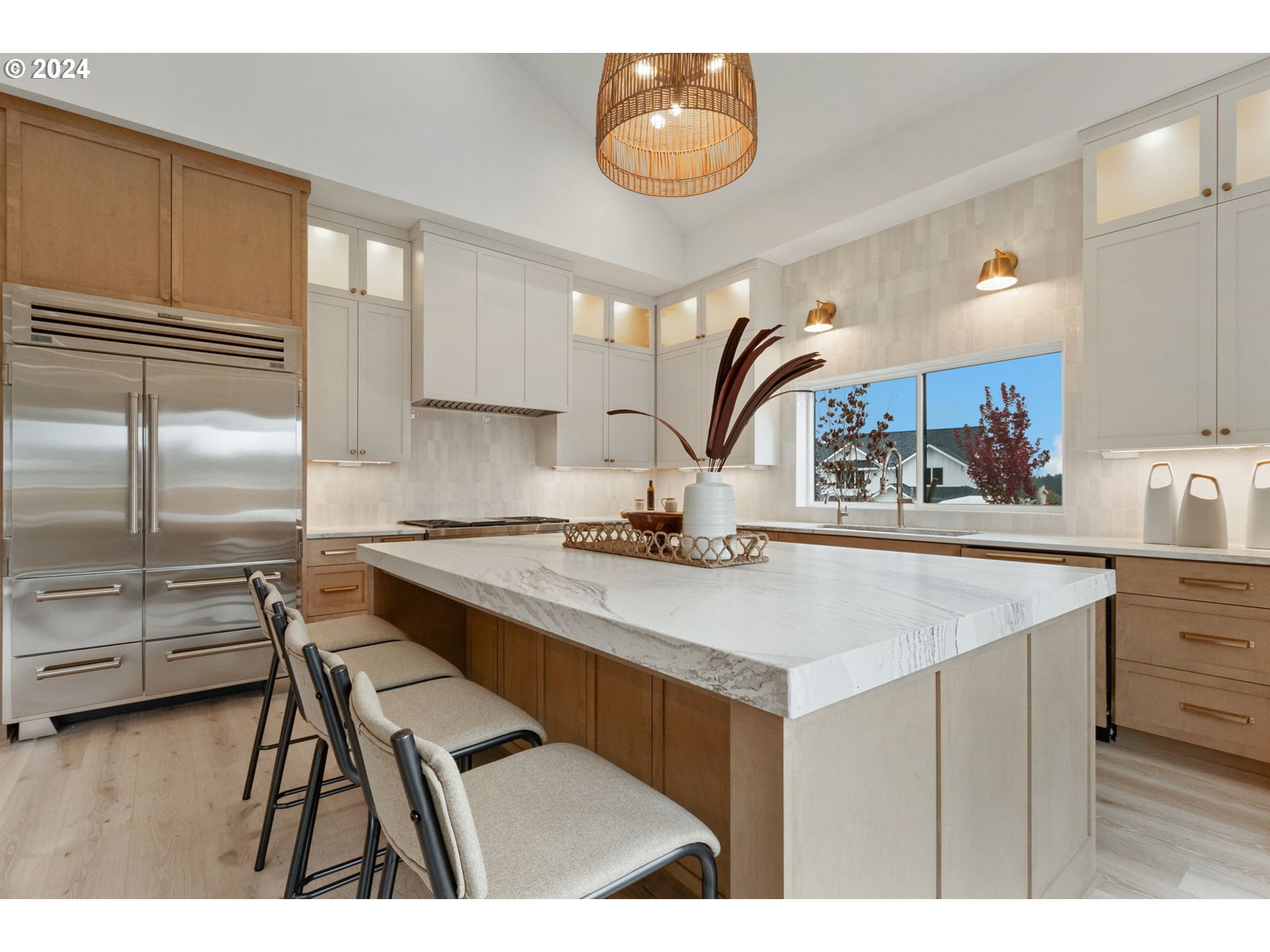 23141 Southwest Curry Ridge Drive Sherwood, OR 97140 - Photo 15 of 47 a kitchen with kitchen island a sink stove and refrigerator