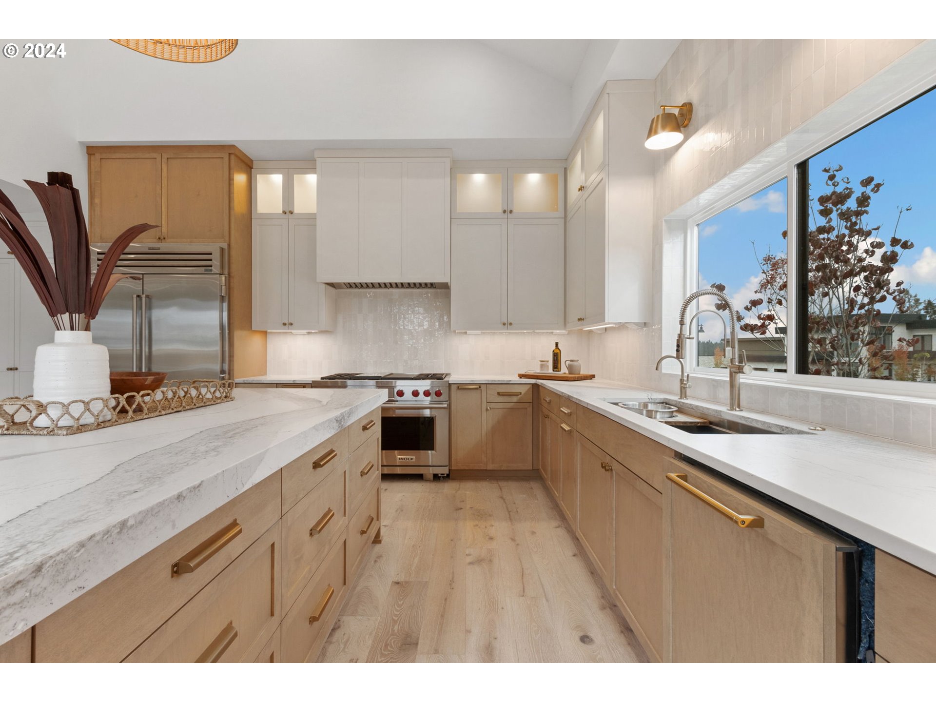 23141 Southwest Curry Ridge Drive Sherwood, OR 97140 - Photo 16 of 47 a kitchen with a sink stove and cabinets