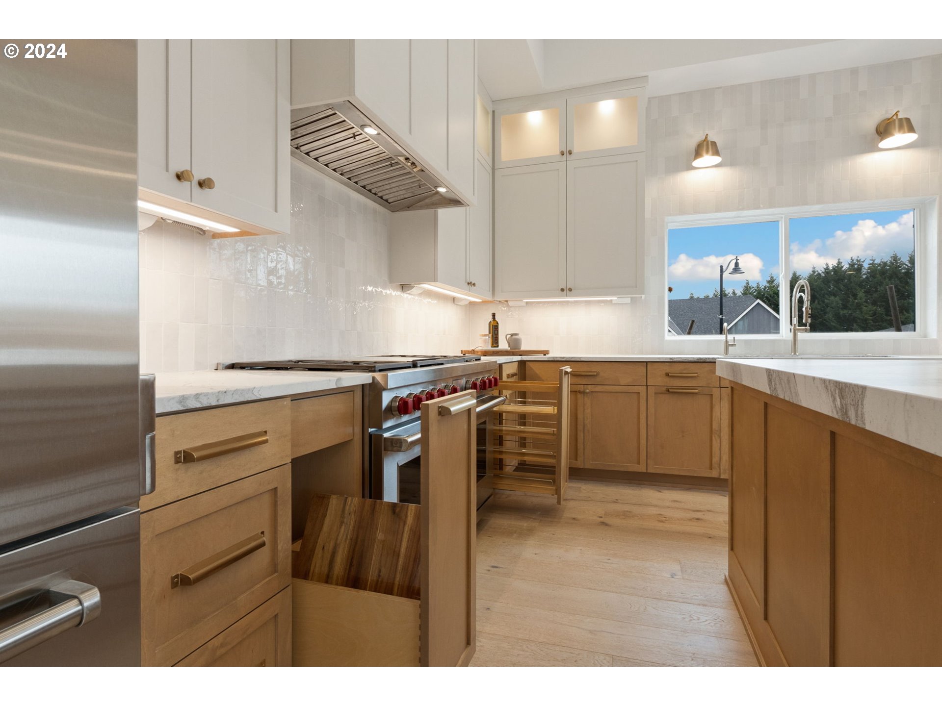 23141 Southwest Curry Ridge Drive Sherwood, OR 97140 - Photo 18 of 47 a kitchen with a sink stainless steel appliances and cabinets