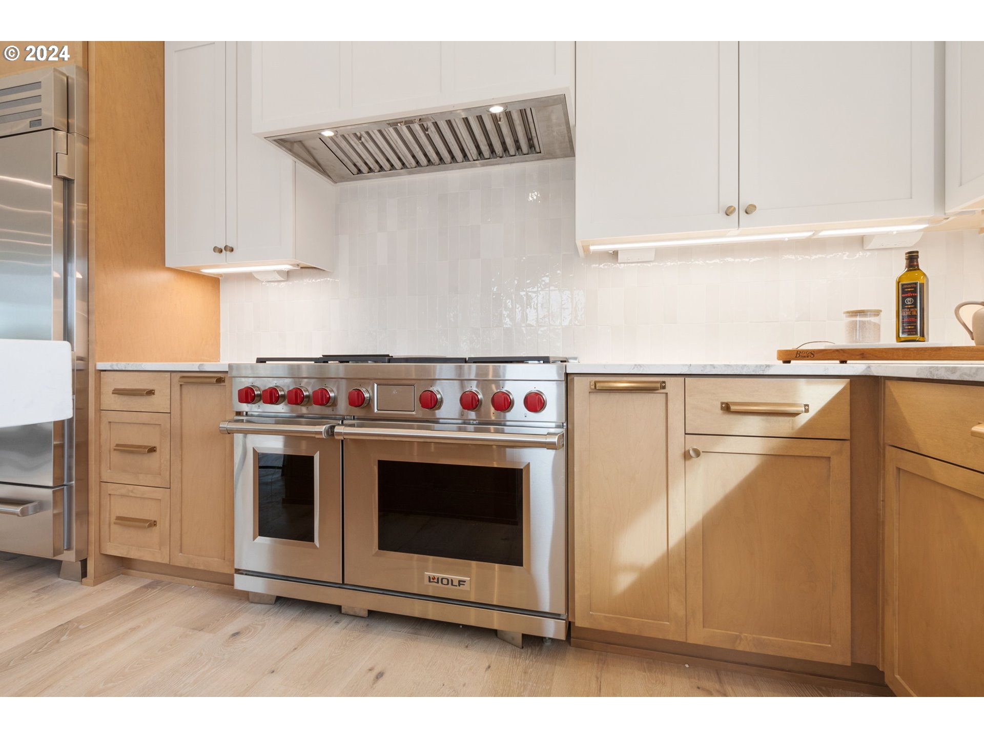 23141 Southwest Curry Ridge Drive Sherwood, OR 97140 - Photo 19 of 47 a stove top oven sitting inside of a kitchen