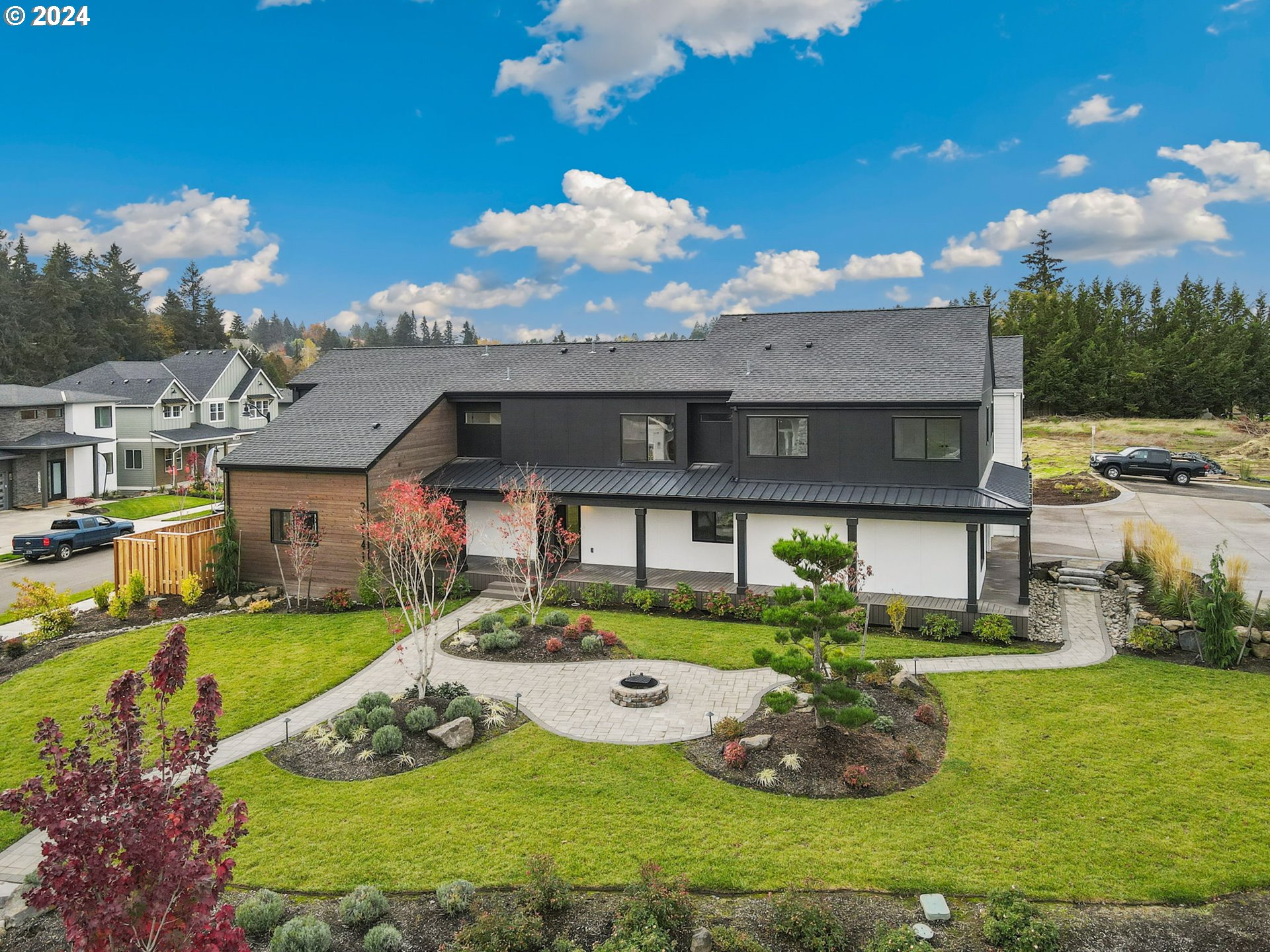 23141 Southwest Curry Ridge Drive Sherwood, OR 97140 - Photo 2 of 47 a view of a house with a big yard potted plants and large tree
