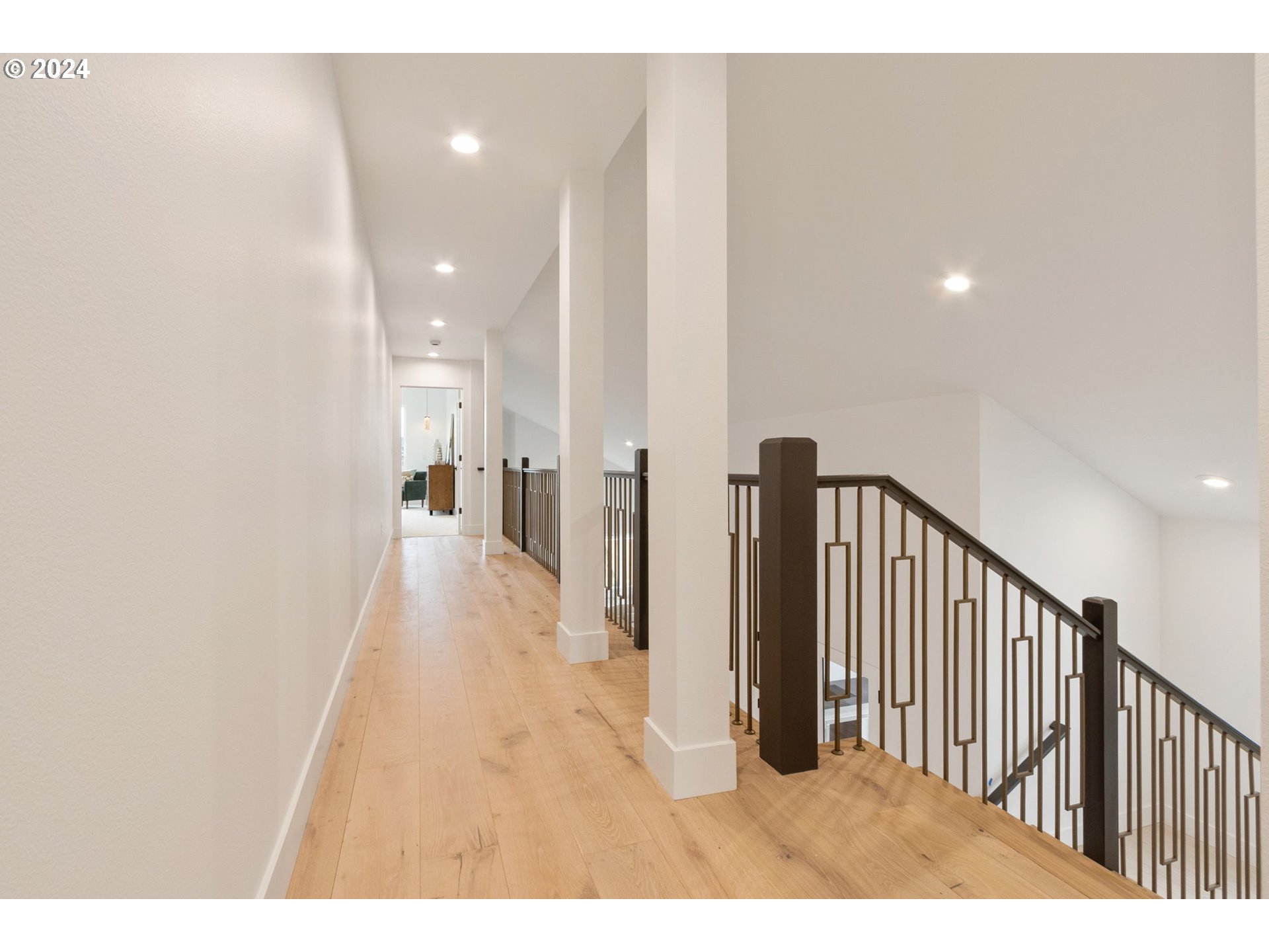 23141 Southwest Curry Ridge Drive Sherwood, OR 97140 - Photo 23 of 47 a view of a hallway with wooden floor