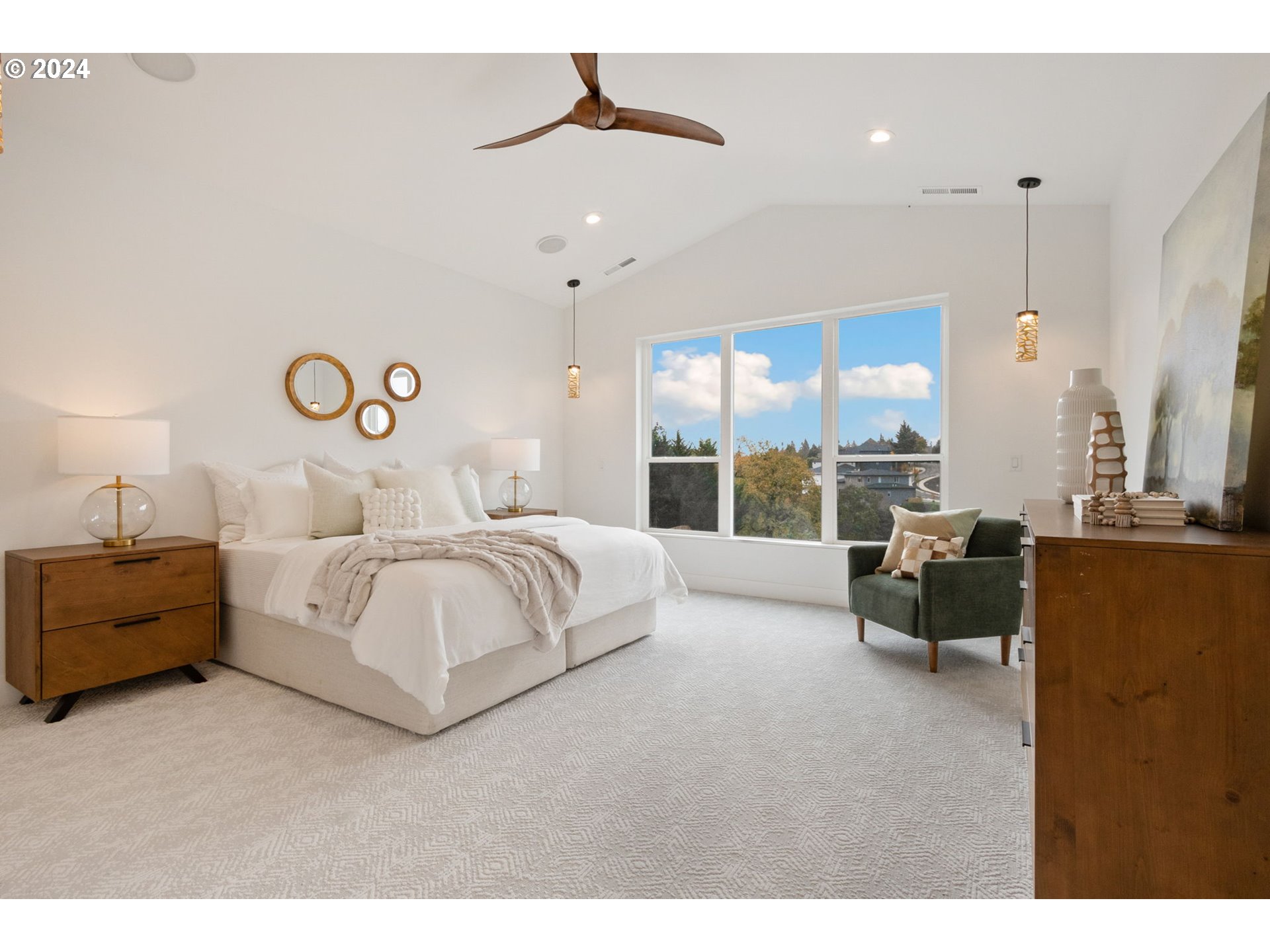 23141 Southwest Curry Ridge Drive Sherwood, OR 97140 - Photo 24 of 47 a spacious bedroom with a bed and a couch