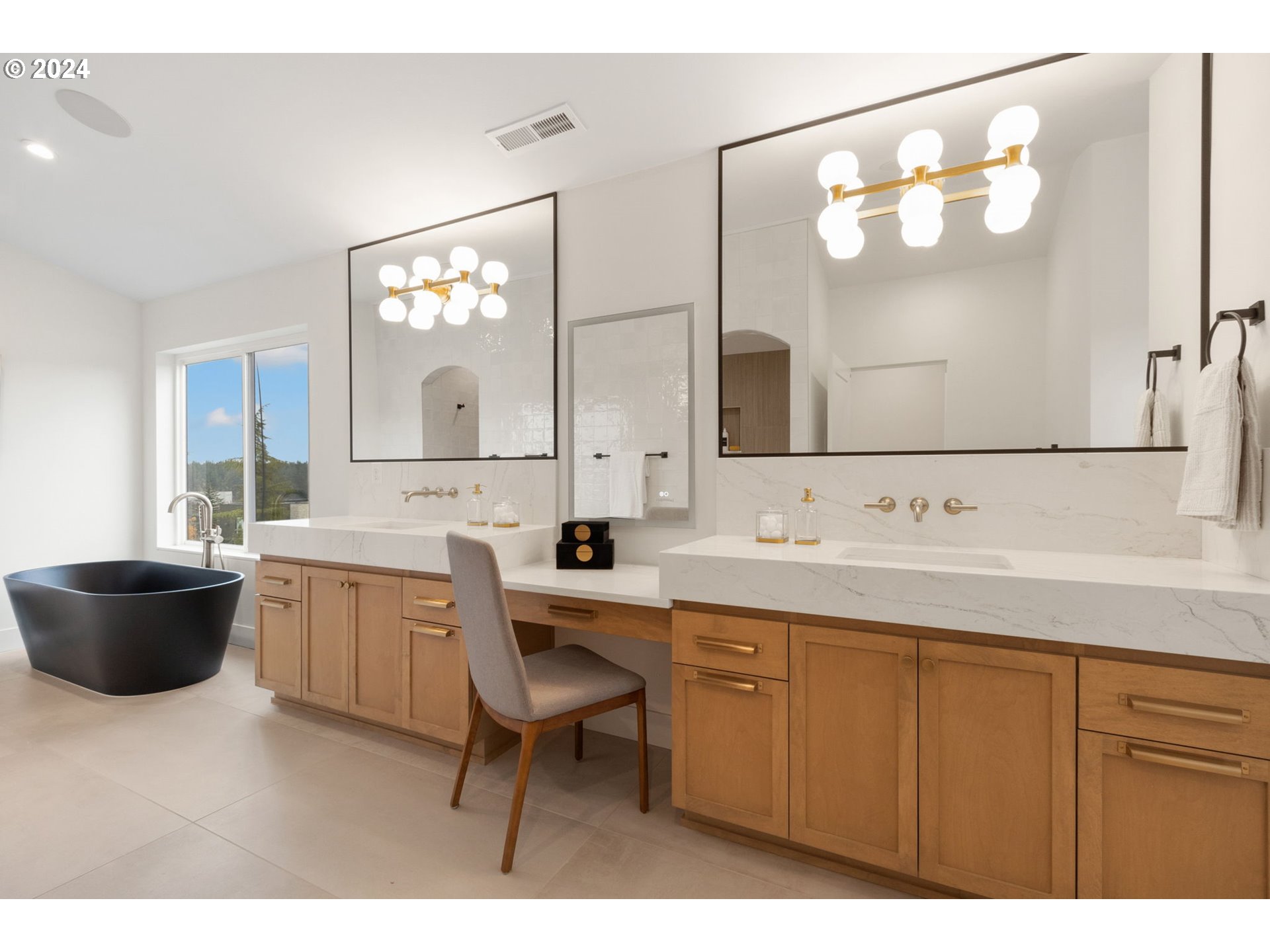 23141 Southwest Curry Ridge Drive Sherwood, OR 97140 - Photo 27 of 47 a bathroom with a tub sink and mirror