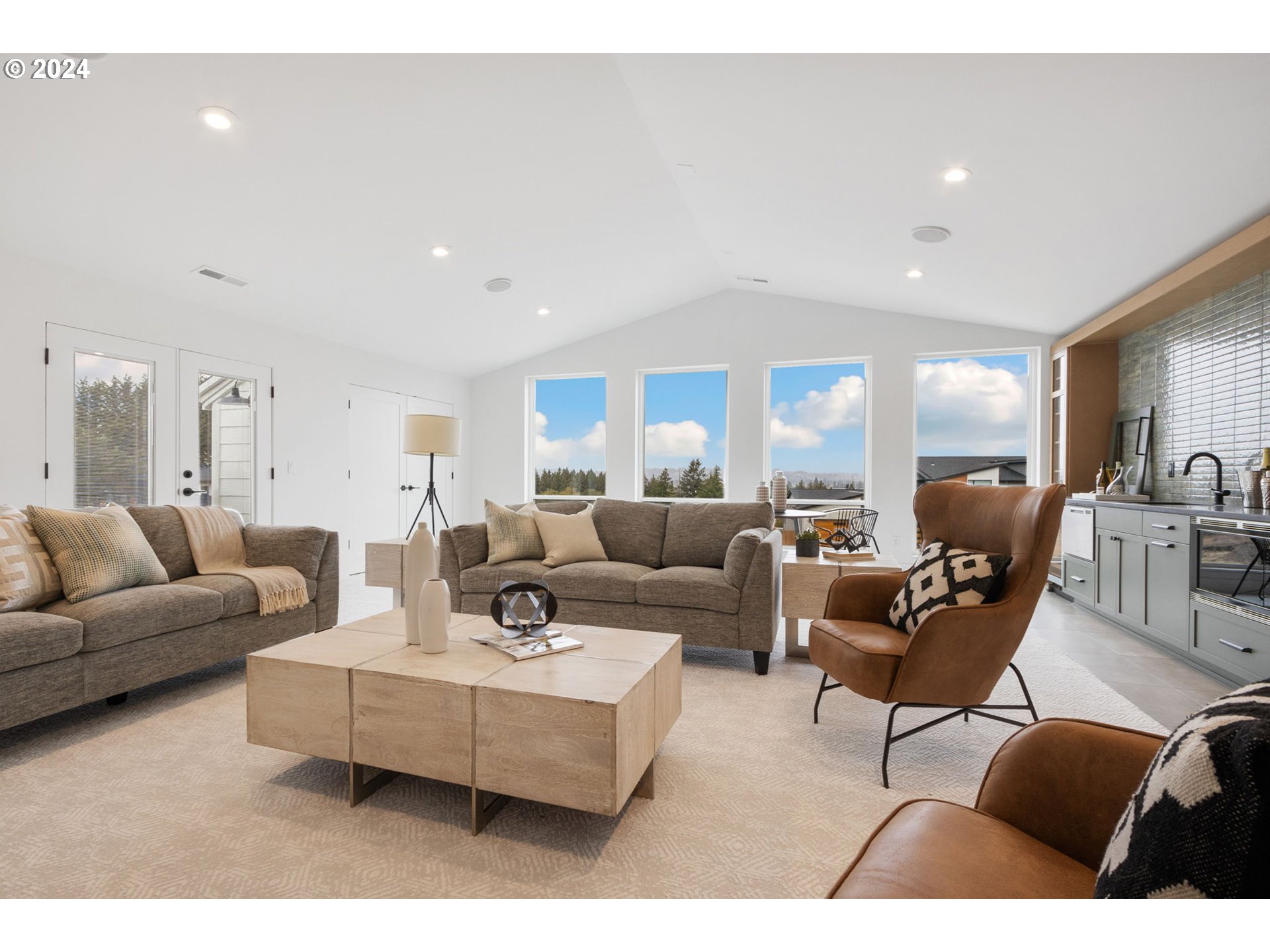 23141 Southwest Curry Ridge Drive Sherwood, OR 97140 - Photo 32 of 47 a living room with furniture and view of kitchen