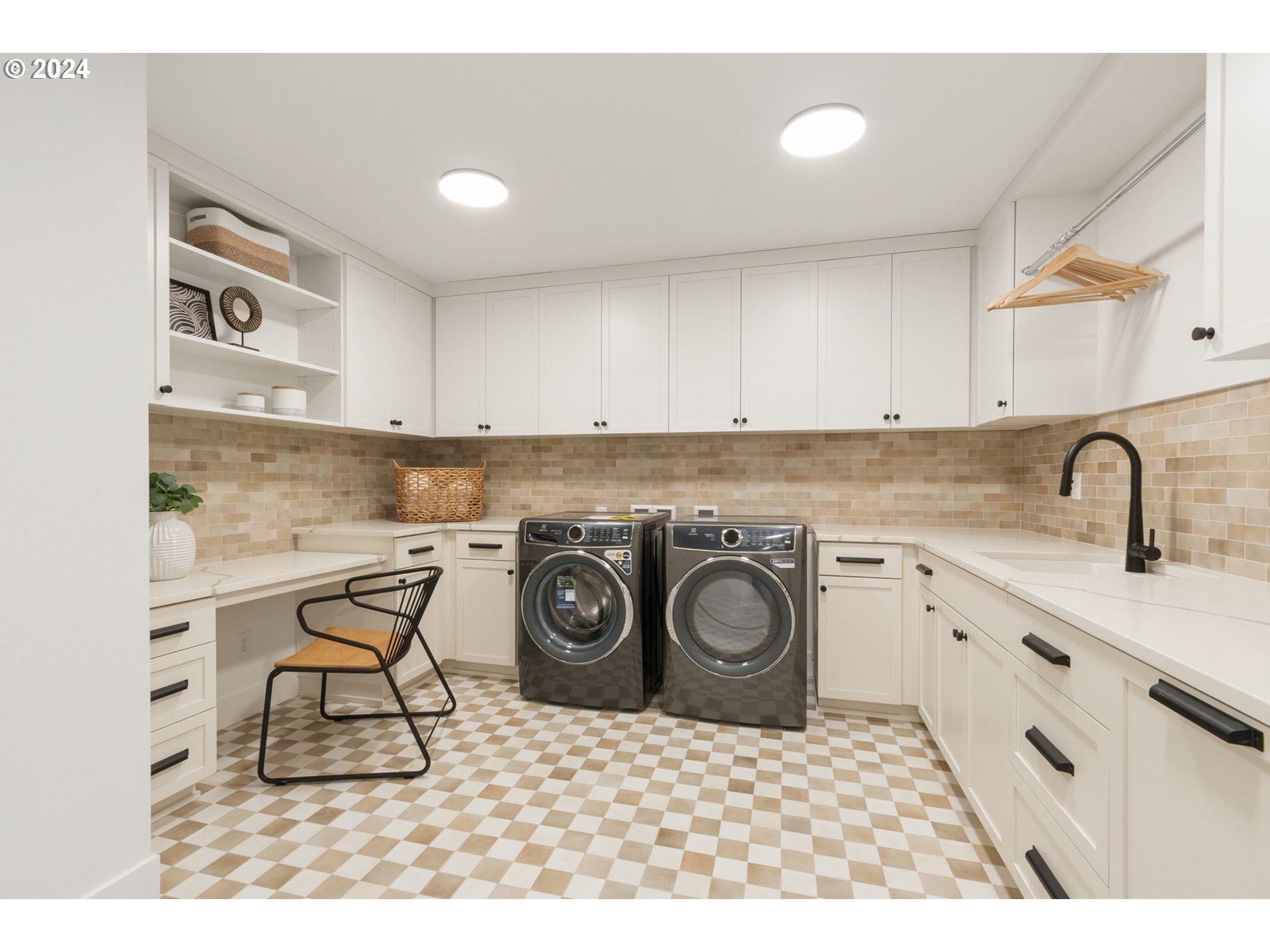 23141 Southwest Curry Ridge Drive Sherwood, OR 97140 - Photo 36 of 47 a kitchen with a sink a stove and cabinets
