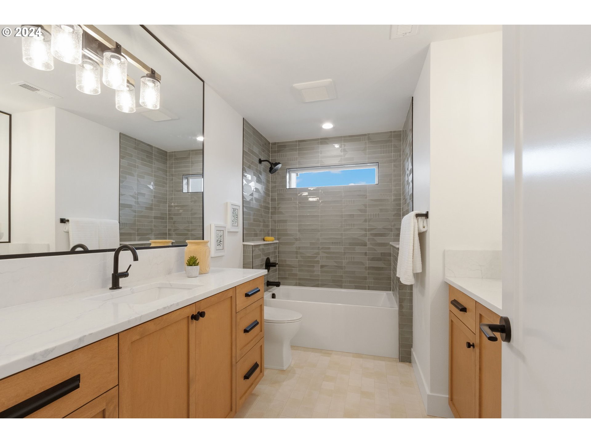 23141 Southwest Curry Ridge Drive Sherwood, OR 97140 - Photo 37 of 47 a bathroom with a sink a toilet a mirror and bathtub
