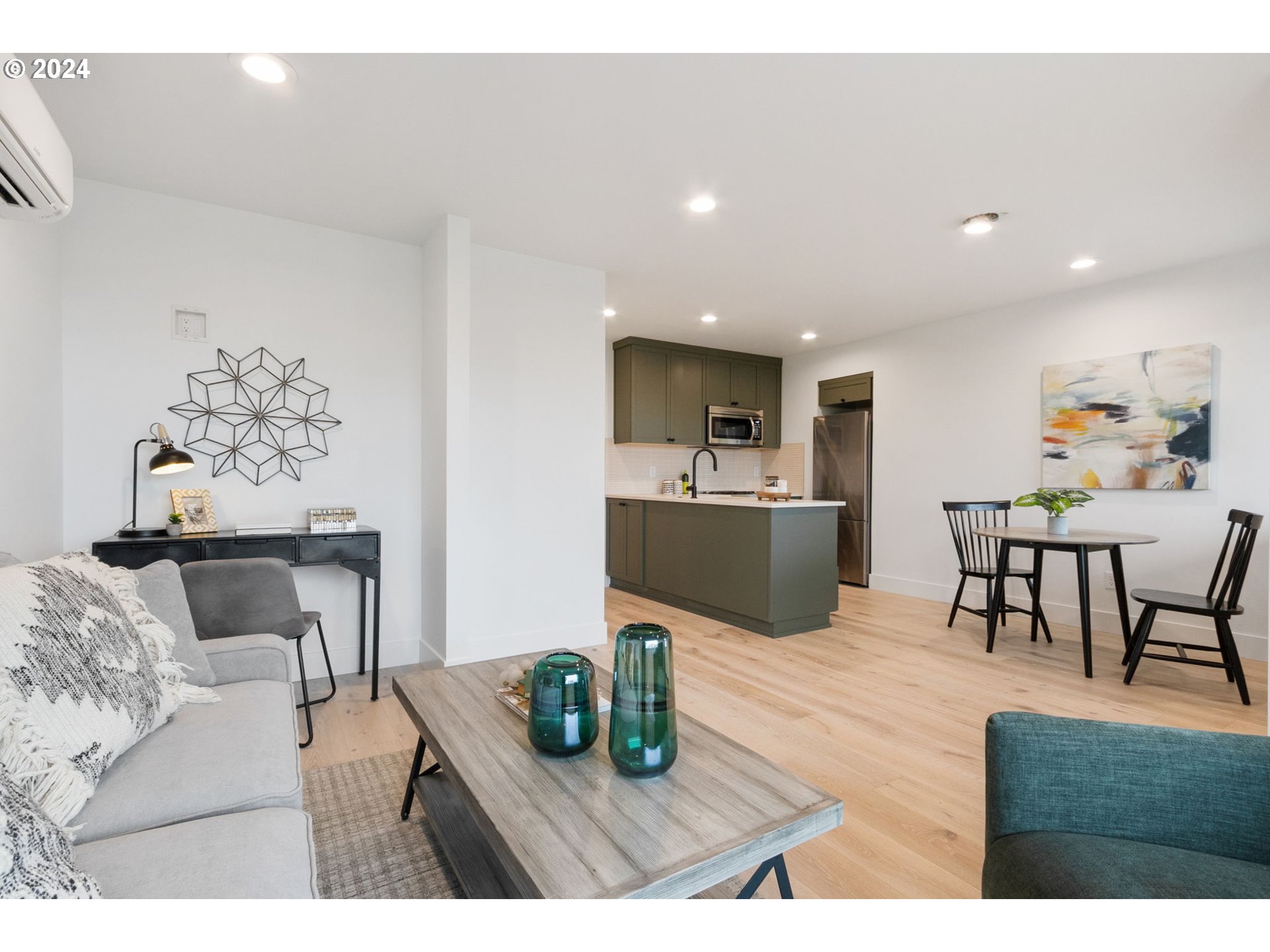 23141 Southwest Curry Ridge Drive Sherwood, OR 97140 - Photo 39 of 47 a living room with furniture and kitchen view