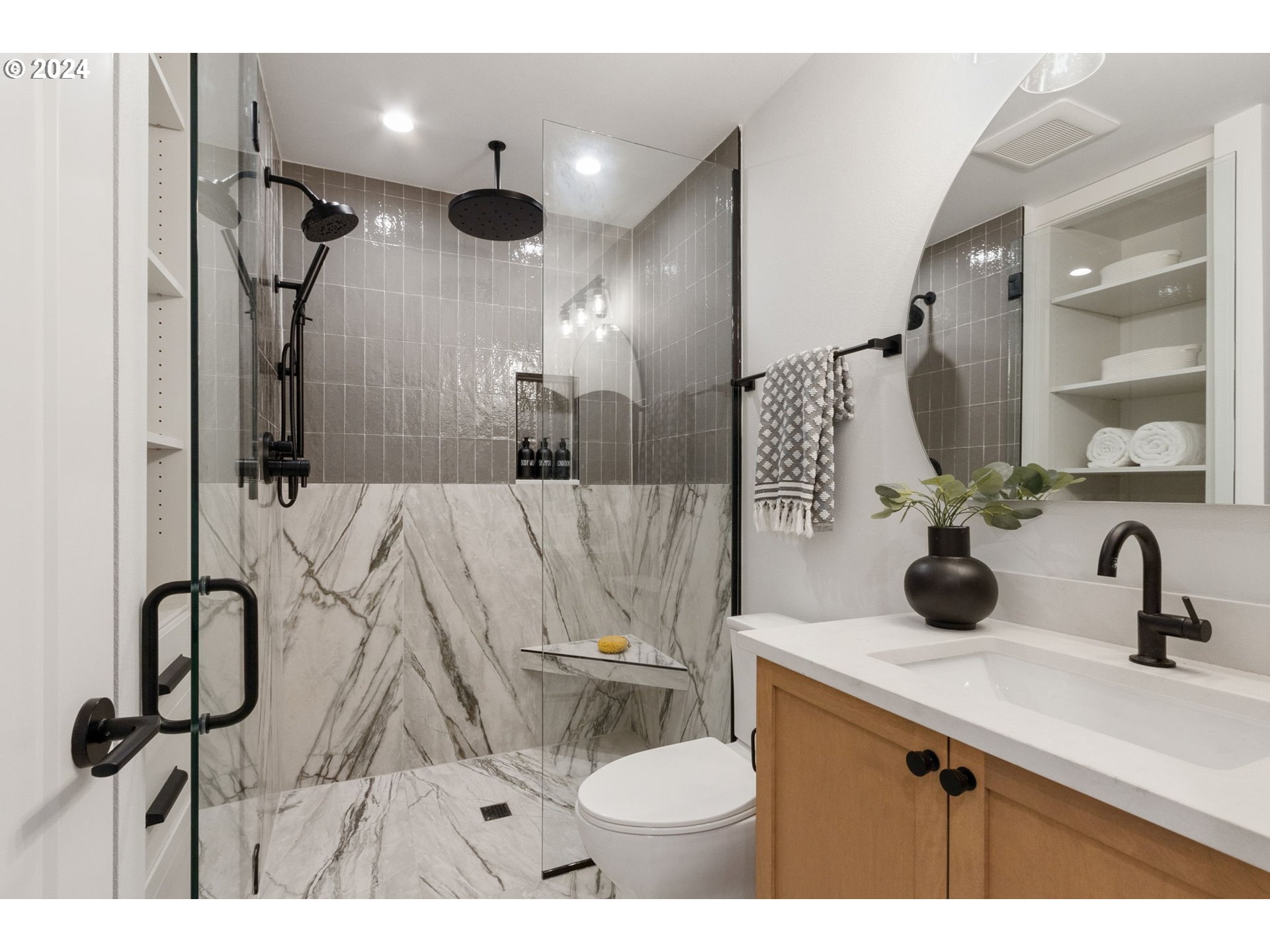23141 Southwest Curry Ridge Drive Sherwood, OR 97140 - Photo 40 of 47 a bathroom with a sink a toilet and a mirror