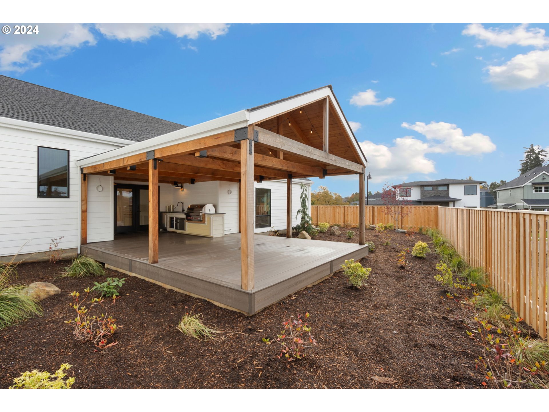 23141 Southwest Curry Ridge Drive Sherwood, OR 97140 - Photo 42 of 47 a view of a house with backyard and porch