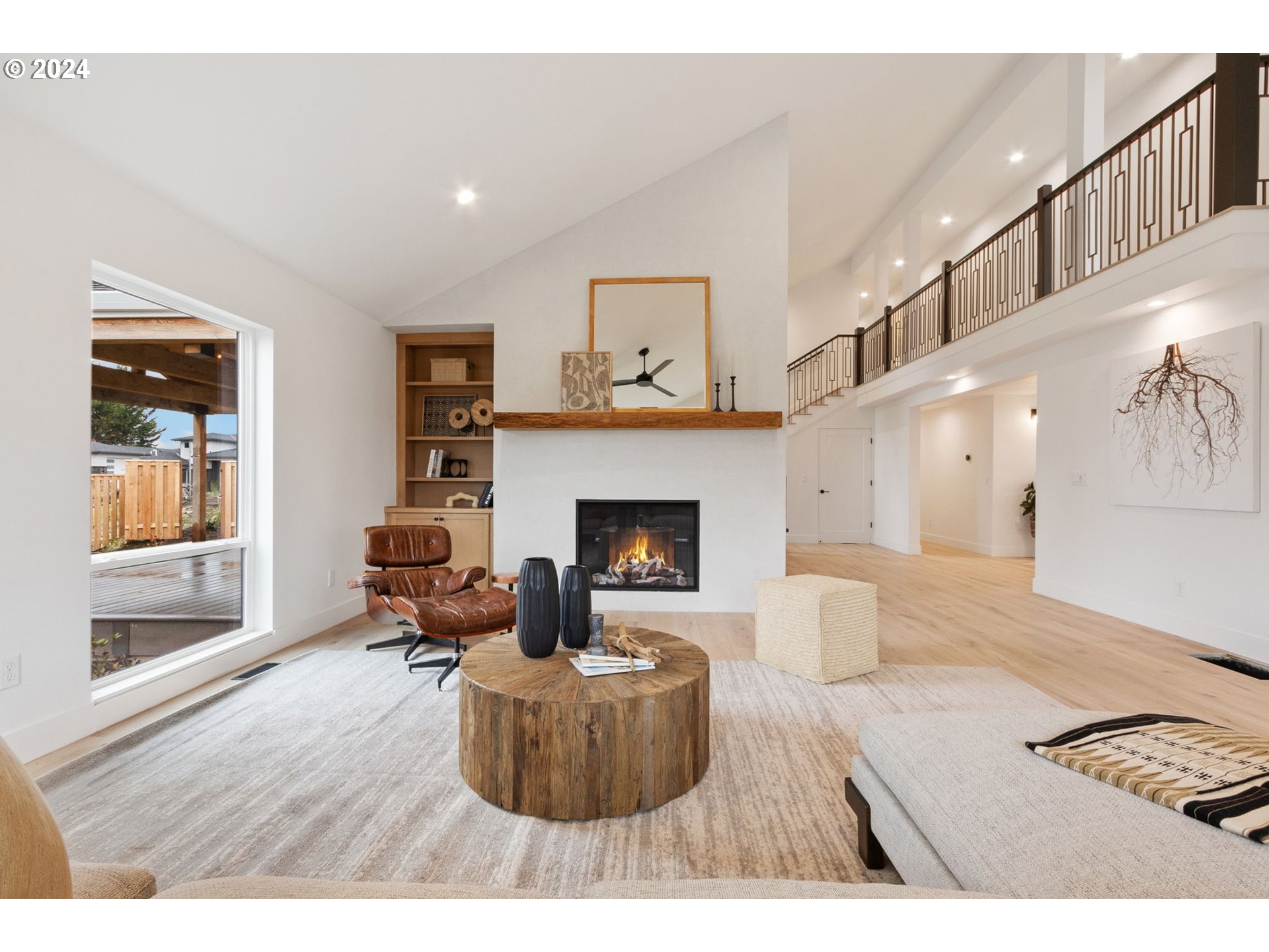 23141 Southwest Curry Ridge Drive Sherwood, OR 97140 - Photo 5 of 47 a living room with furniture and a fireplace
