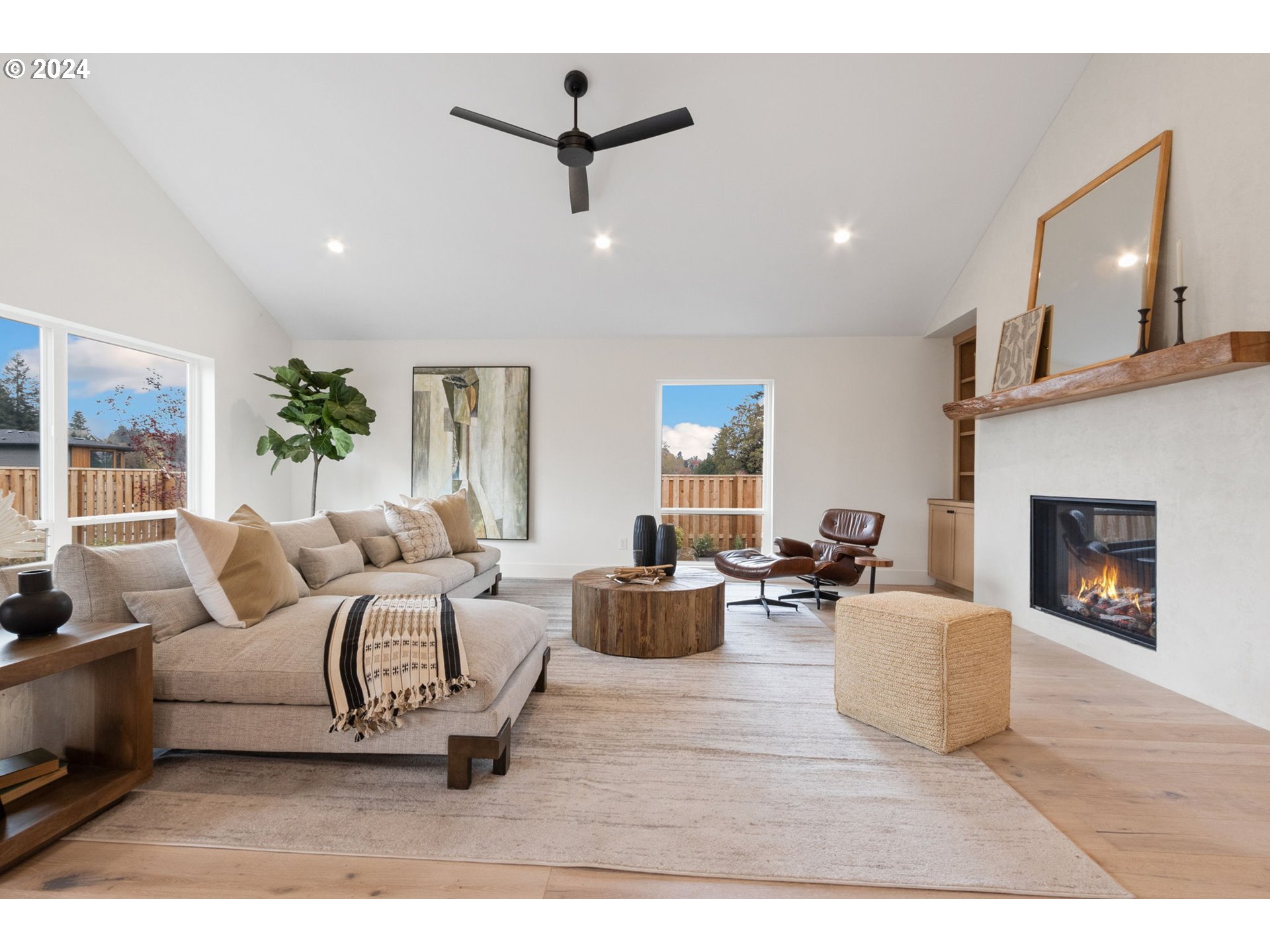23141 Southwest Curry Ridge Drive Sherwood, OR 97140 - Photo 6 of 47 a living room with furniture and a fireplace