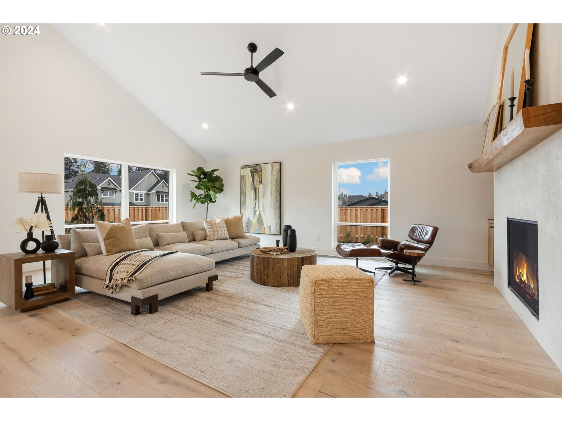 23141 Southwest Curry Ridge Drive Sherwood, OR 97140 - Photo 7 of 47 a living room with furniture and a fireplace