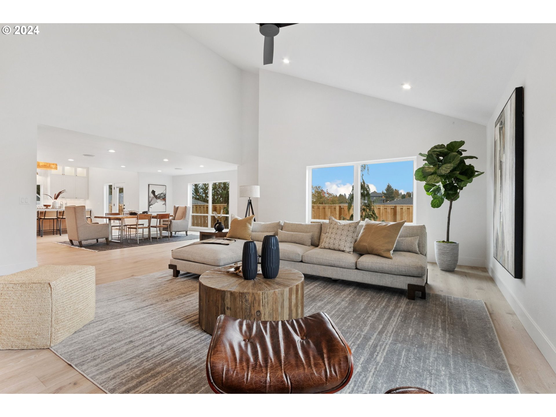 23141 Southwest Curry Ridge Drive Sherwood, OR 97140 - Photo 8 of 47 a living room with furniture and a wooden floor