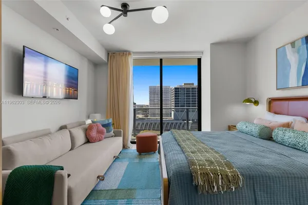 a bedroom with a bed and window