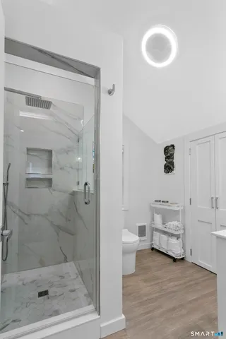 a bathroom with a sink vanity and a mirror