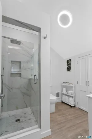 a bathroom with a sink vanity and a mirror