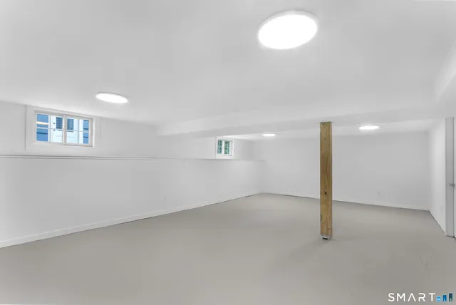 an empty room with a empty space and a window