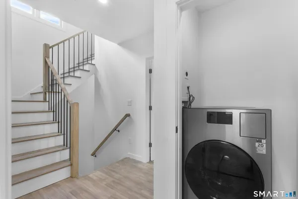 a view of a hallway with washer and dryer