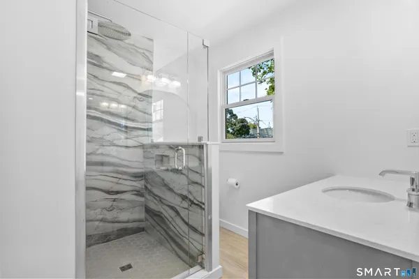 a bathroom with a sink and shower