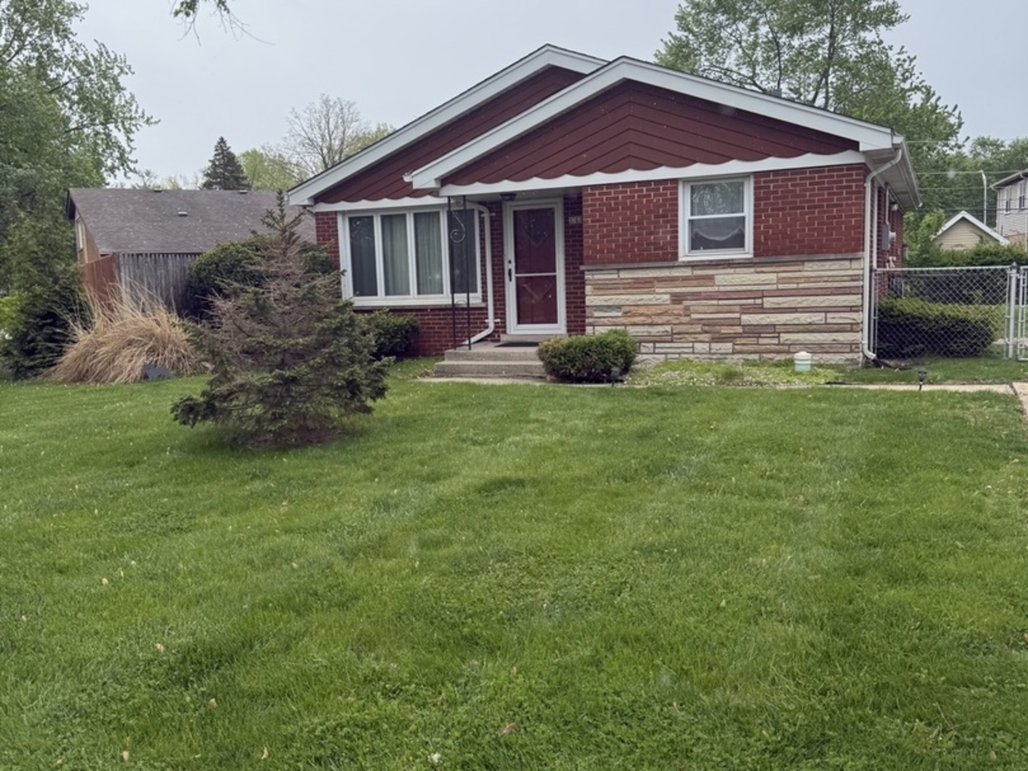 3763 153rd Street Midlothian, IL 60445 - Photo 1 of 17 a front view of a house with a garden