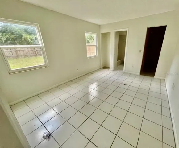 a view of an empty room and window