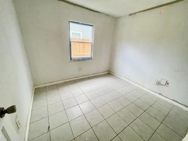 a view of an empty room and window