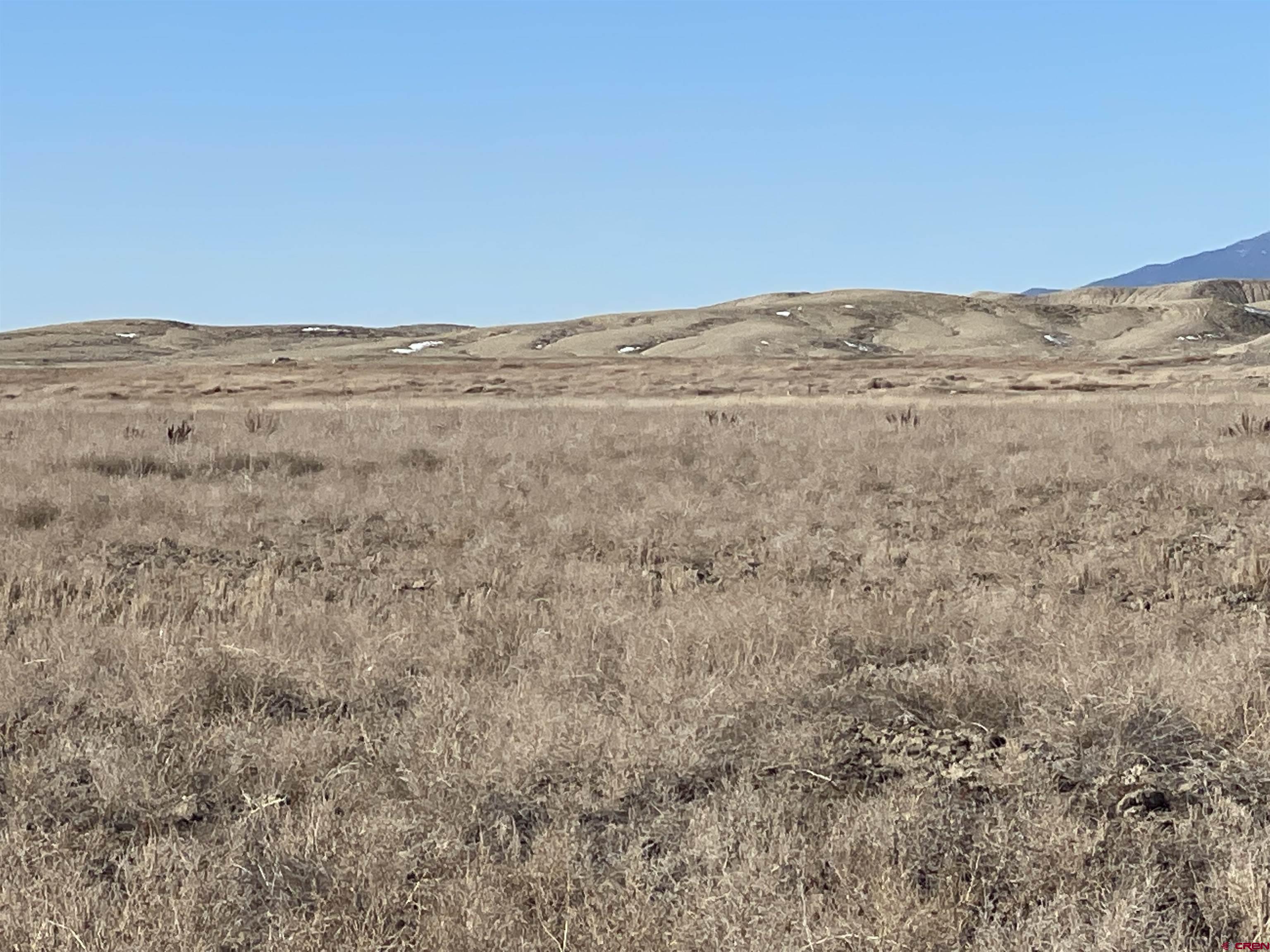 64233 Peach Valley Road Montrose, CO 81401 - Photo 11 of 26 a view of beach and ocean