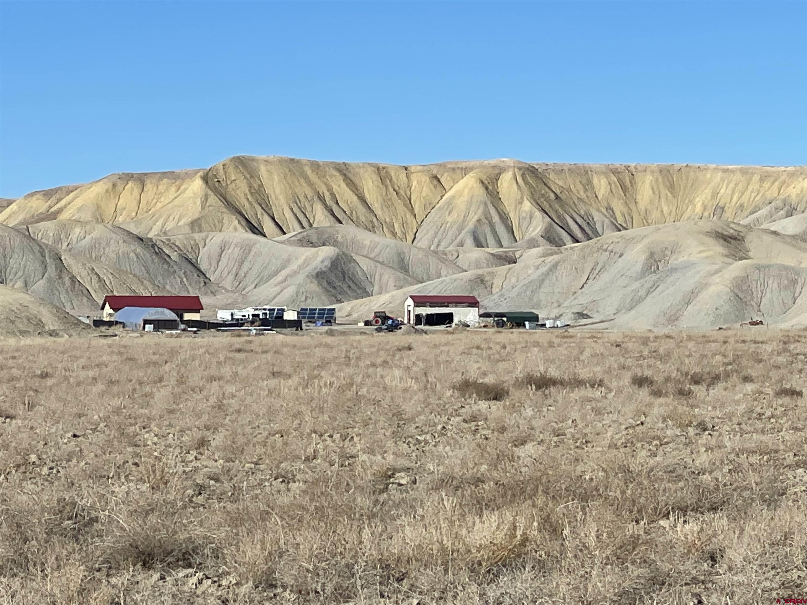 64233 Peach Valley Road Montrose, CO 81401 - Photo 12 of 26 a view of a couch in front of a house