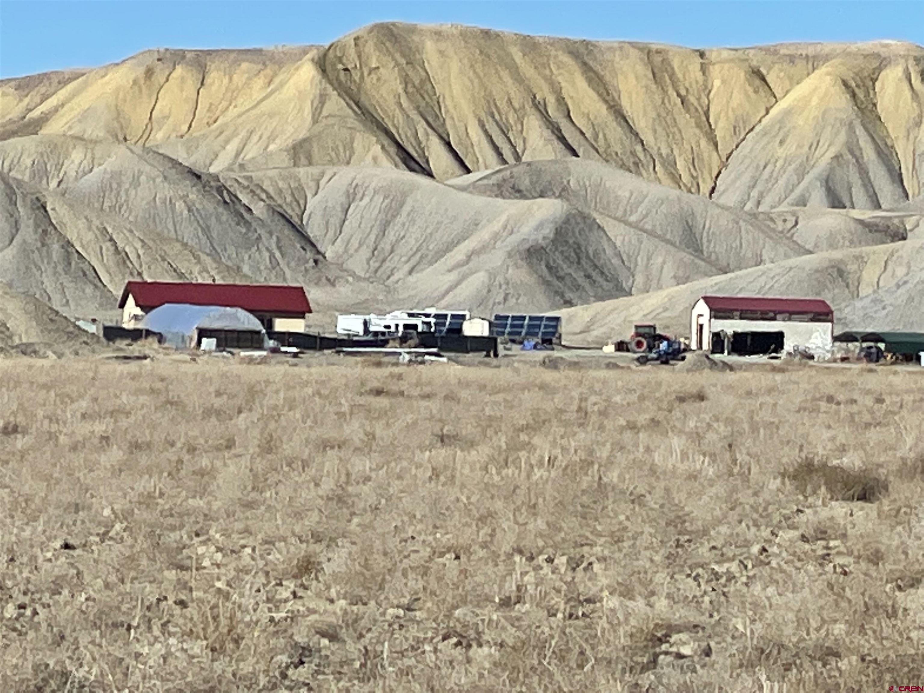 64233 Peach Valley Road Montrose, CO 81401 - Photo 14 of 26 a view of a street with of the house