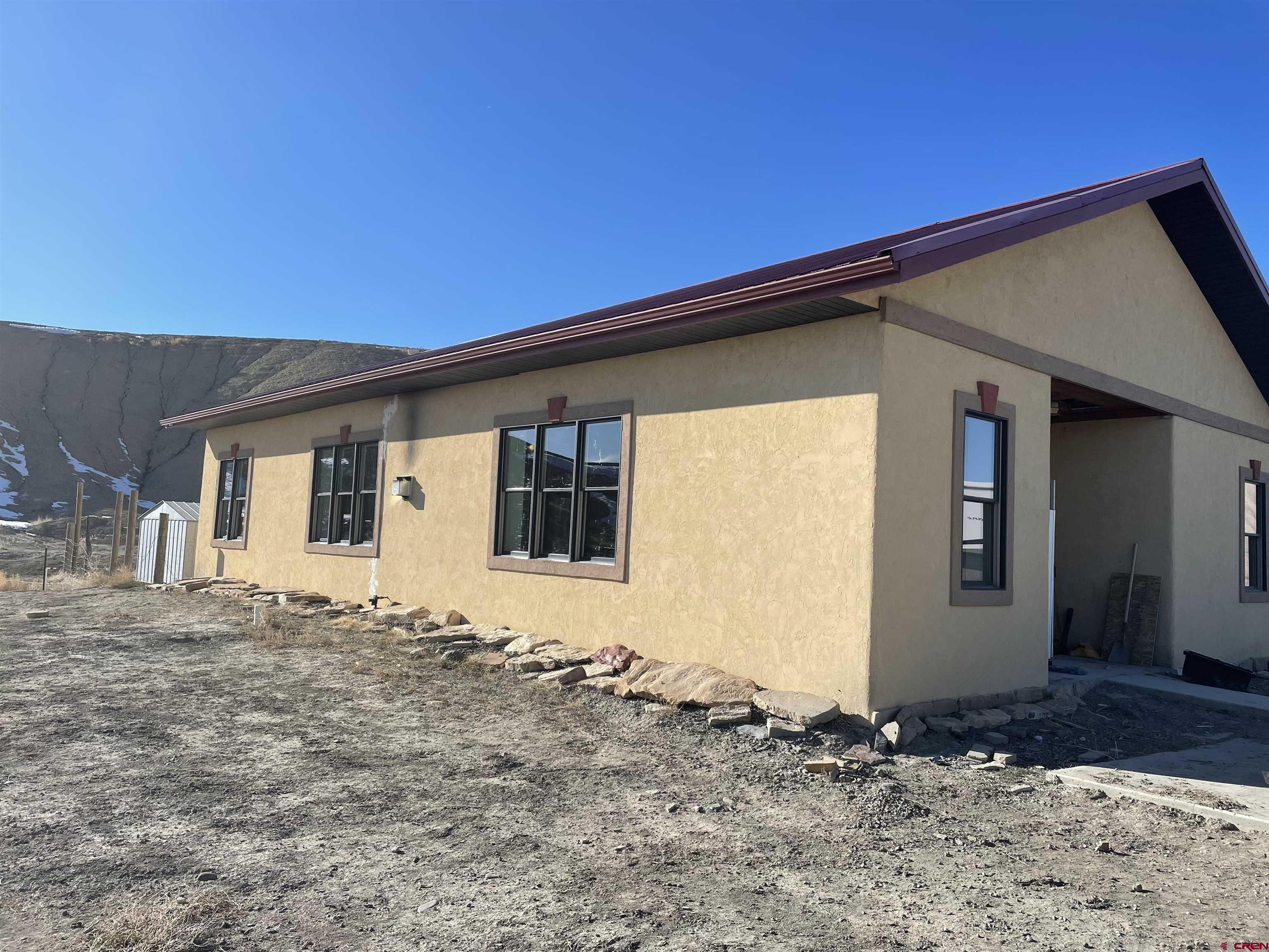 64233 Peach Valley Road Montrose, CO 81401 - Photo 4 of 26 a front view of a house