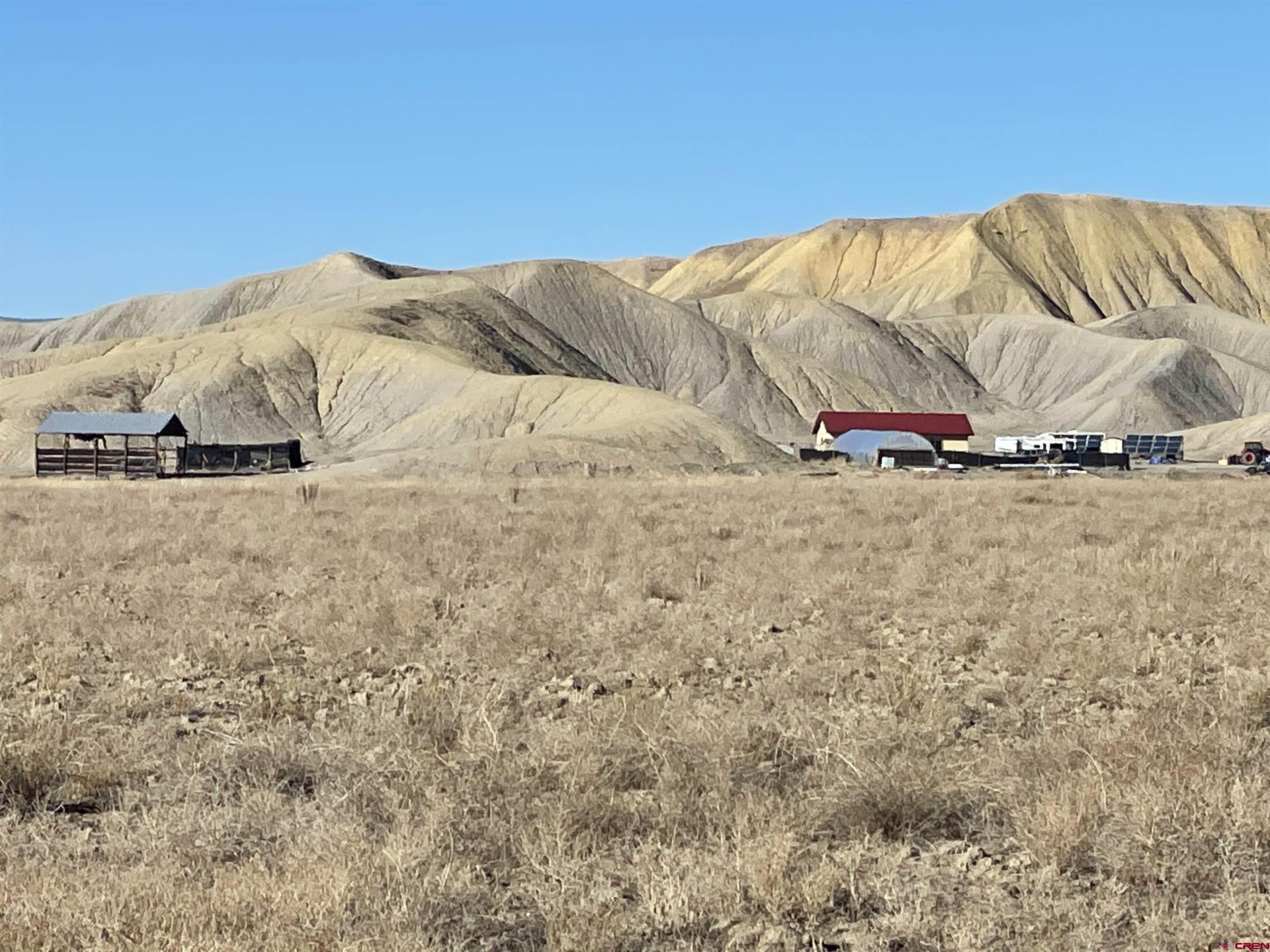 64233 Peach Valley Road Montrose, CO 81401 - Photo 9 of 26 a view of a outdoor space with a mountain