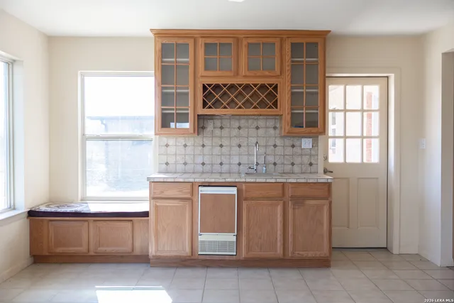a kitchen with a sink and cabinets